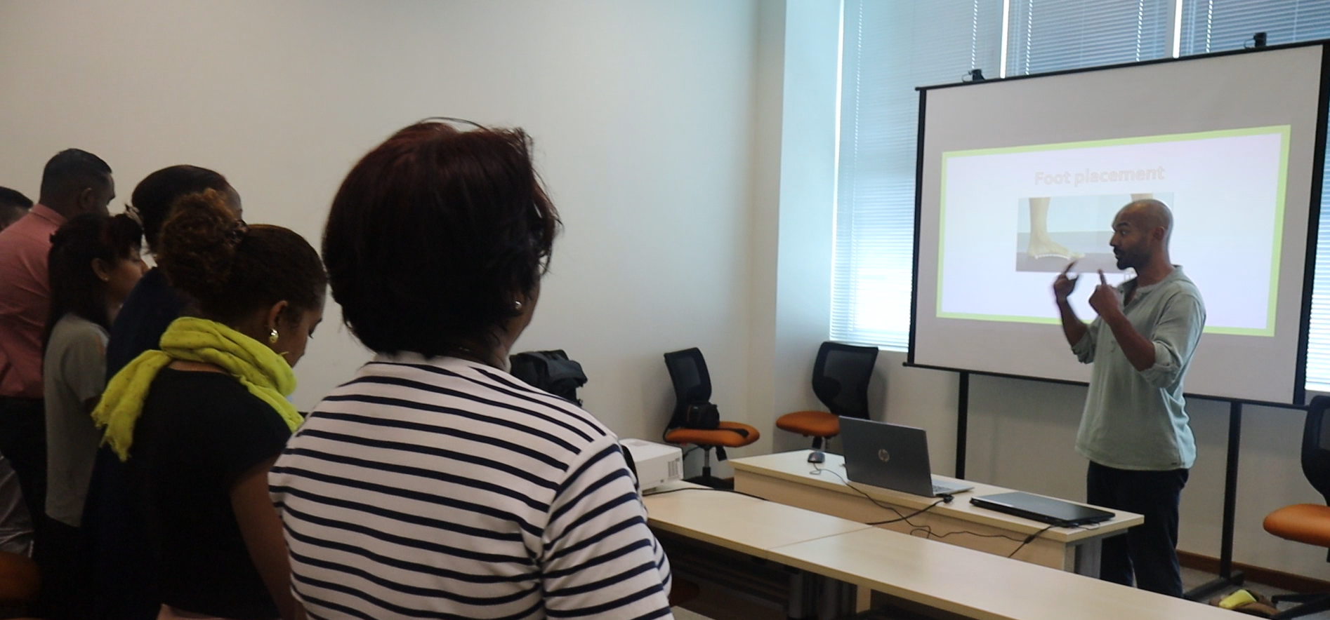 Victor delivering a workplace seminar — showing the science